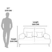 Sofa dimensions shown with a standing person for scale on a white background