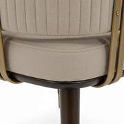 Spike channel-stitched chair back with brass strap close-up
