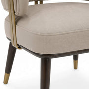 Spike chair seat and brass-capped leg close-up