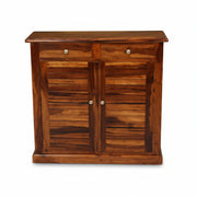 Wooden cabinet with two doors and two drawers on a white background