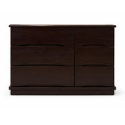Dark brown dresser with four drawers on a white background