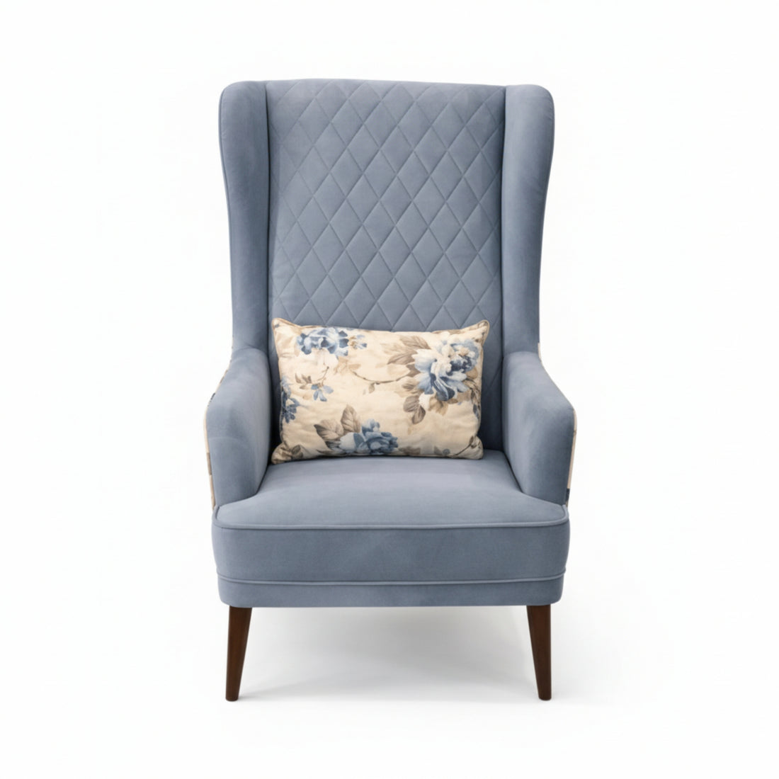 Gray armchair with a floral pillow on a white background