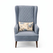 Gray armchair with a floral pillow on a white background
