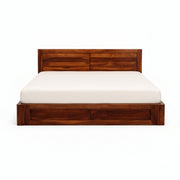 Wooden bed frame with white mattress on a white background