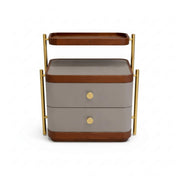 Two-tiered serving cart with wooden accents and gold handles on a white background