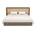 Bed with beige headboard and bedding on a white background