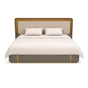 Bed with beige headboard and bedding on a white background