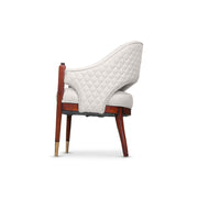 Chair with quilted white backrest and wooden frame on a white background