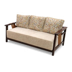 Wooden sofa with patterned backrest and beige seat cushion on a white background