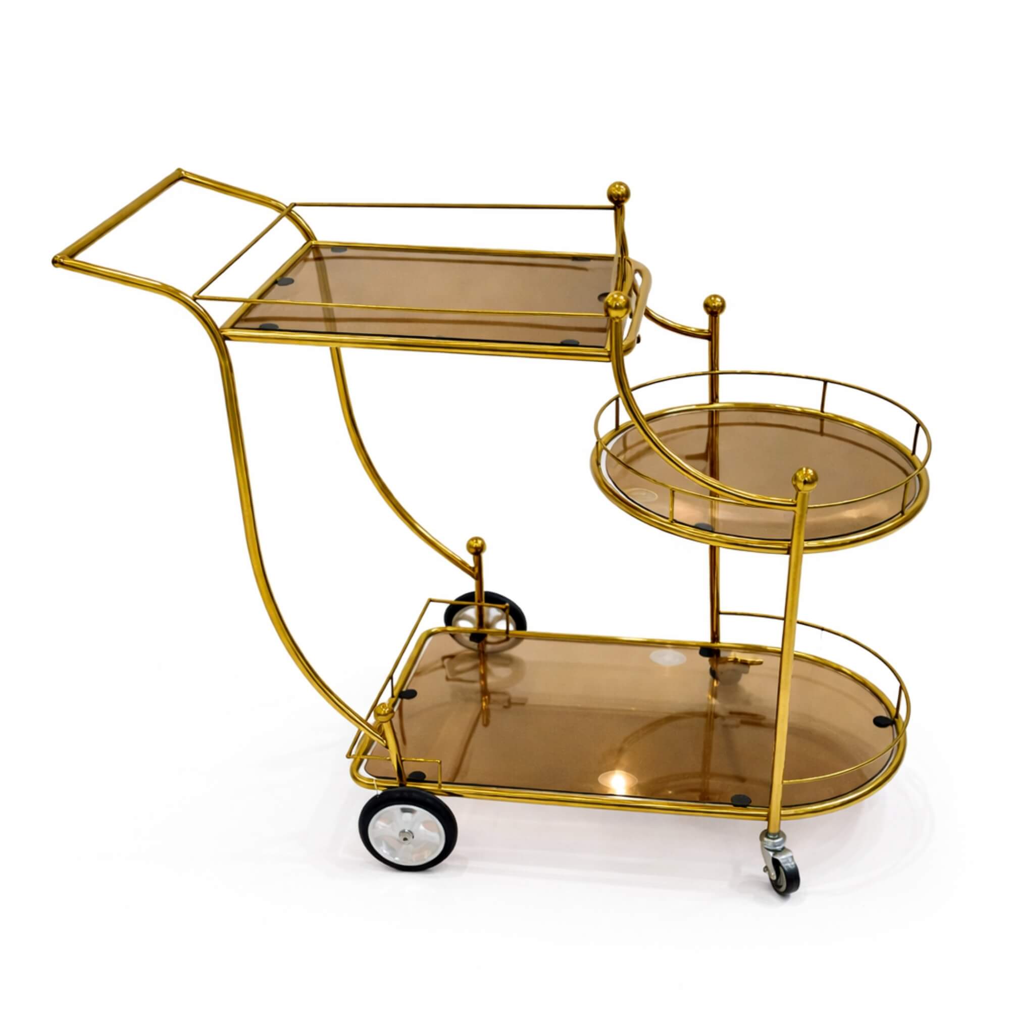 Gold three-tiered serving cart with smoked glass shelves on a white background