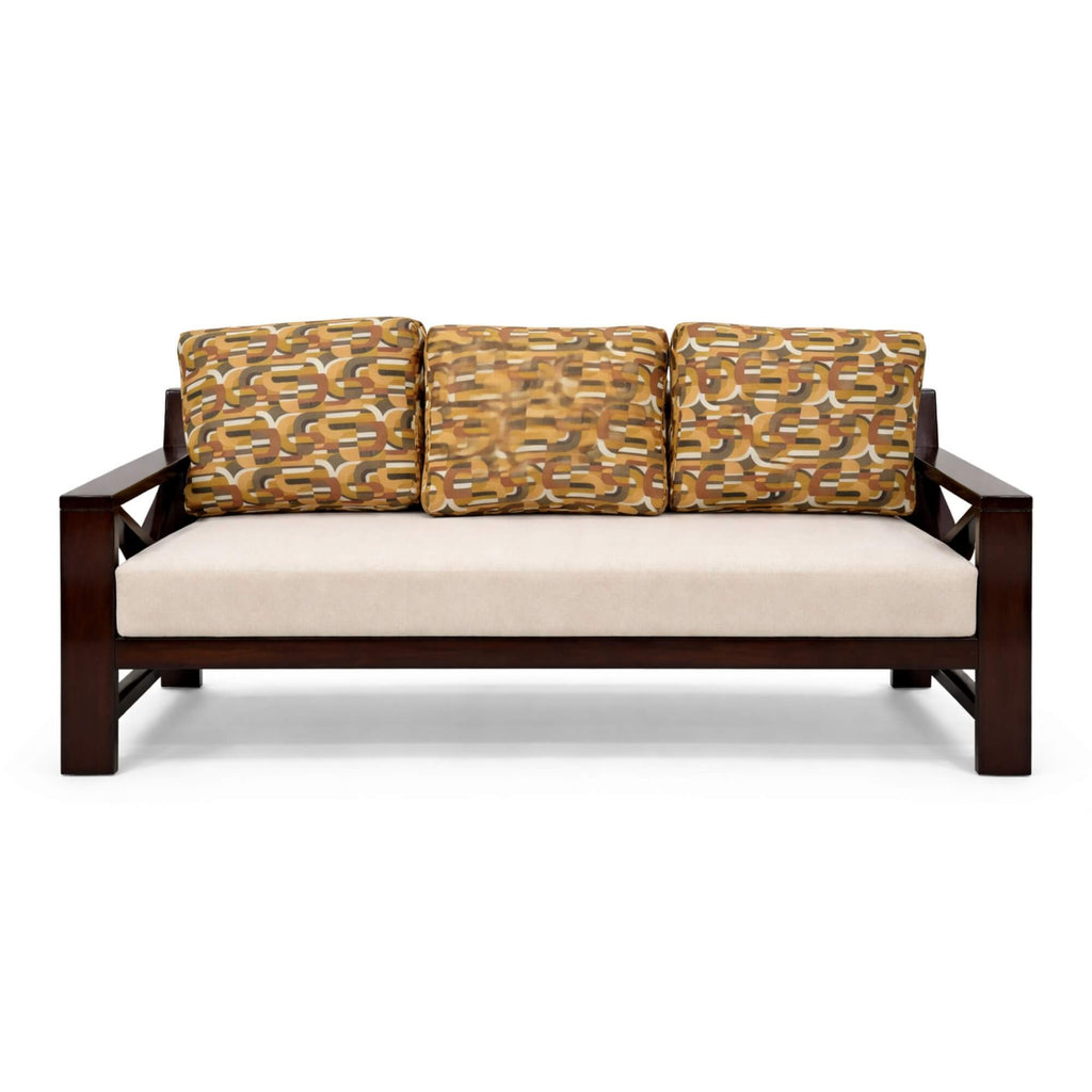 Wooden sofa with patterned cushions on a white background