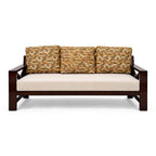 Wooden sofa with patterned cushions on a white background