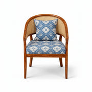 Chair with blue patterned cushion on a white background