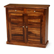 Wooden cabinet with two doors and a drawer on a white background