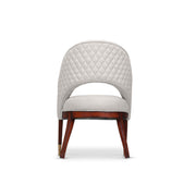 Chair with quilted backrest and wooden legs on a white background