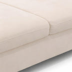 Elton Divider’s seamless stitching and soft texture of the cream fabric upholstery along the cushion seam make it elegantly beautiful.