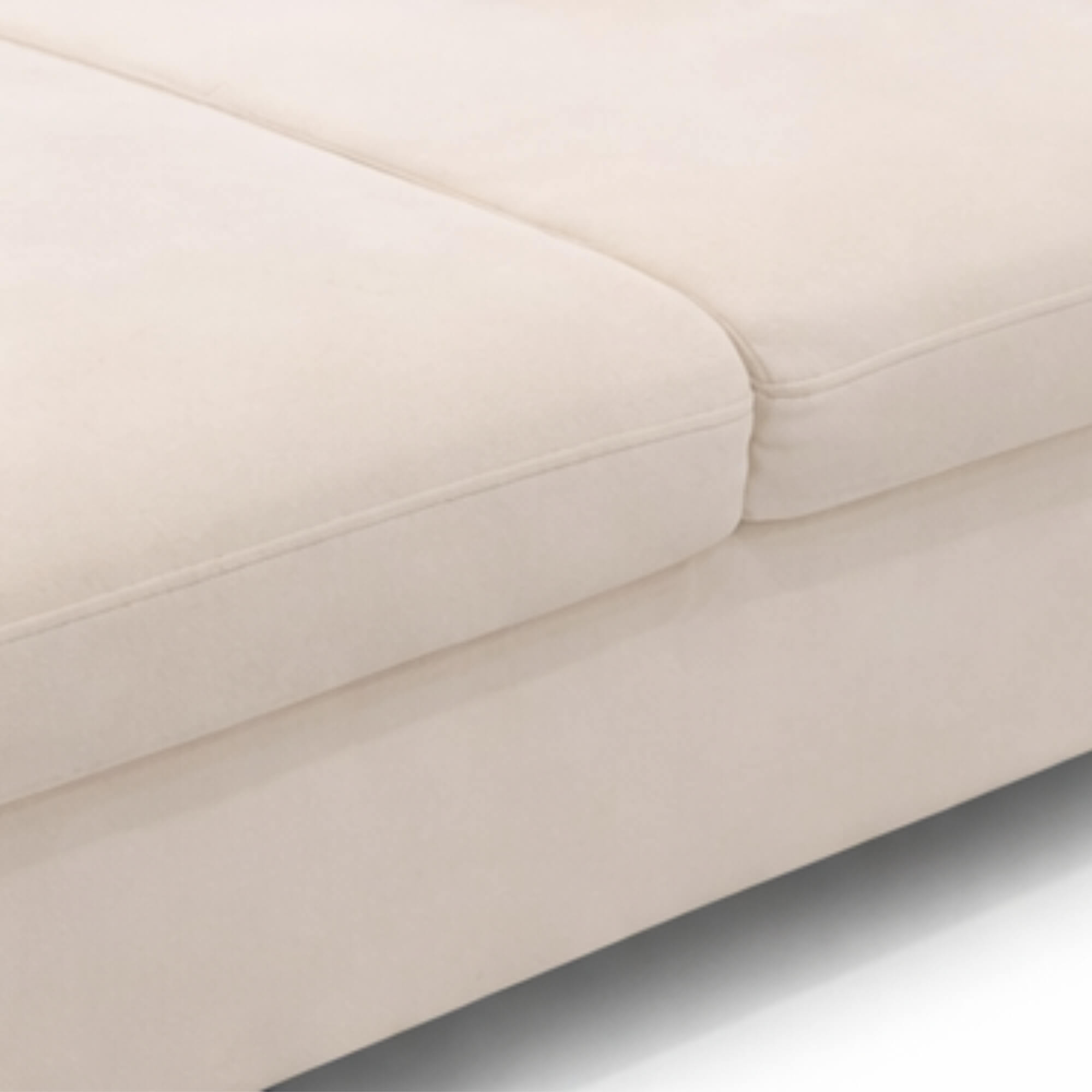 Elton Divider’s seamless stitching and soft texture of the cream fabric upholstery along the cushion seam make it elegantly beautiful.