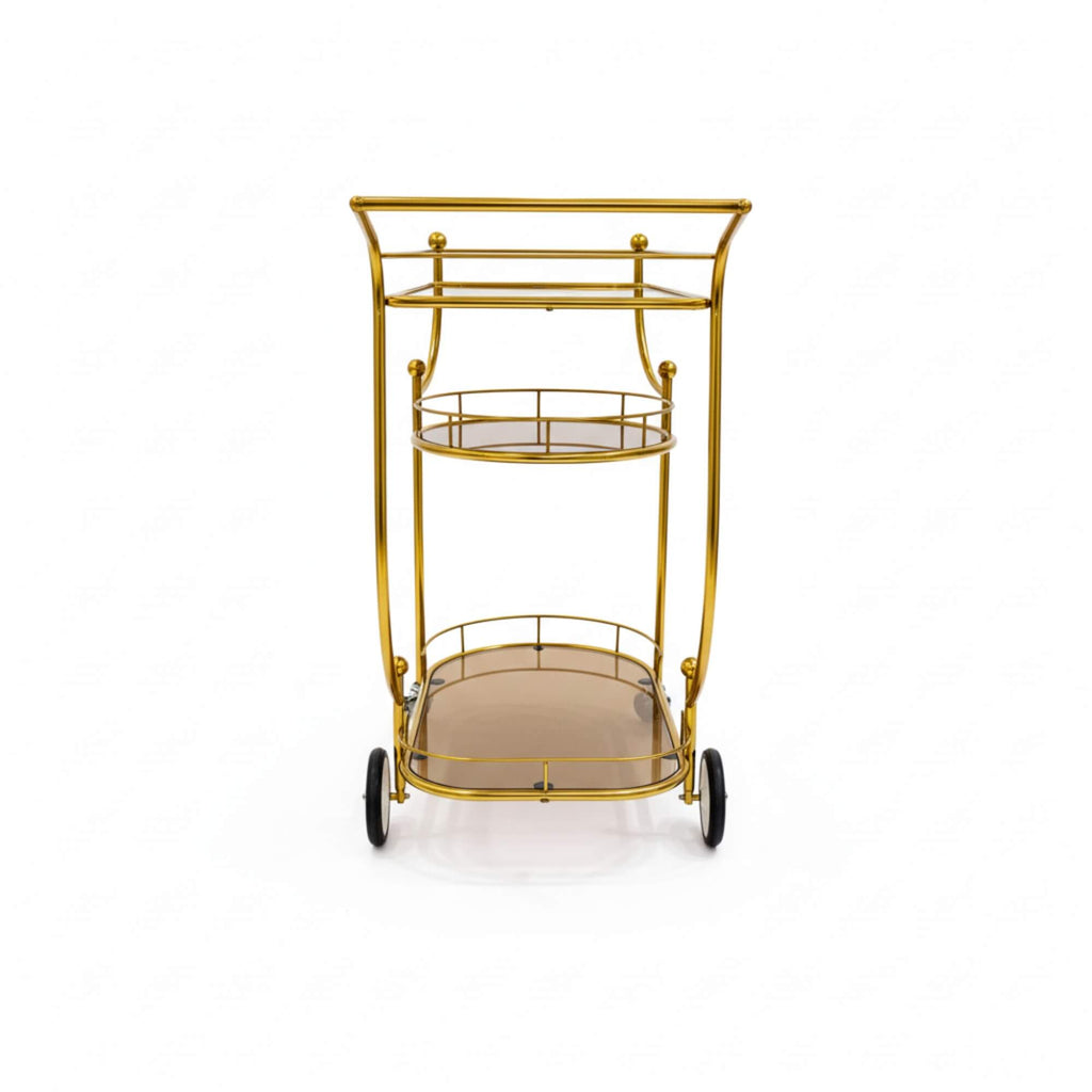 Gold metal serving cart with two shelves on a white background