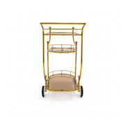 Gold metal serving cart with two shelves on a white background