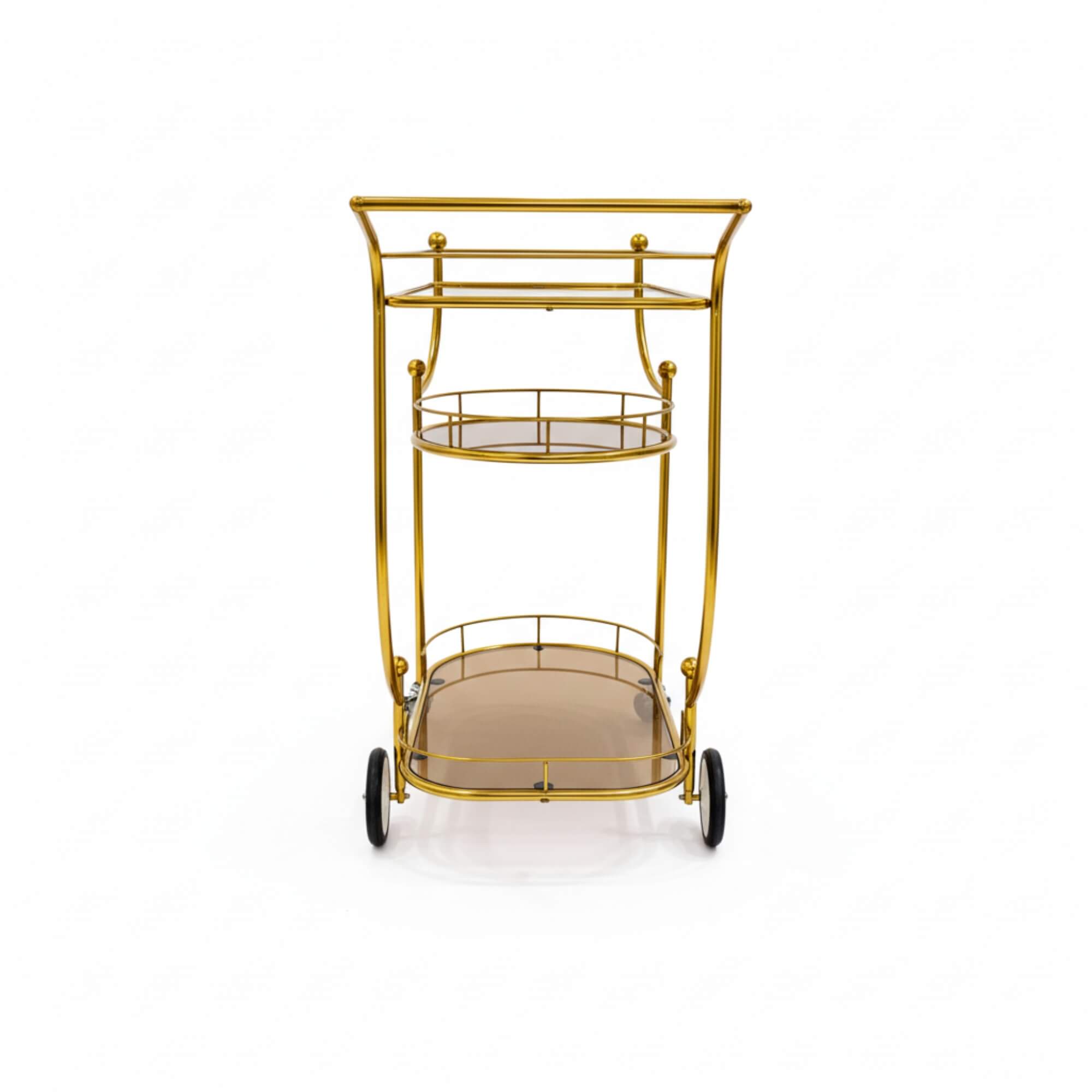 Gold metal serving cart with two shelves on a white background