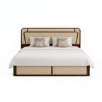 Beige bed with white bedding and decorative pillows on a white background