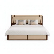 Beige bed with white bedding and decorative pillows on a white background