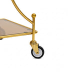 Gold bar cart with a clear glass shelf on a white background