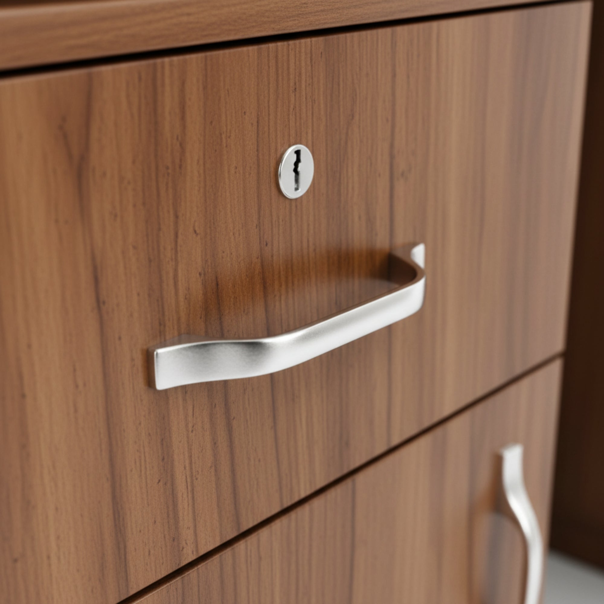 Wooden drawer with metal handle and keyhole
