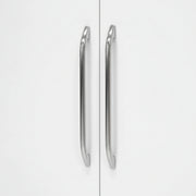 Silver handles on a white cabinet door