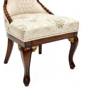 Boomer dining chair damask seat and carved leg close-up