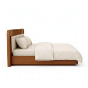 Wooden bed with white bedding on a white background