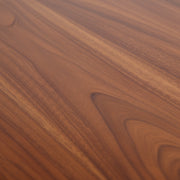 Close-up of a wooden surface with a rich, dark brown color and visible grain pattern.