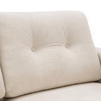Close-up of a beige upholstered chair with button tufting on a white background
