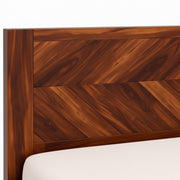 Wooden headboard with a white mattress corner