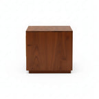 Wooden cube-shaped side table on a white background
