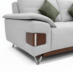Gray sofa with wooden armrest and green cushions on a white background