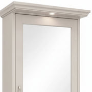 Light gray cabinet with a mirror on a white background
