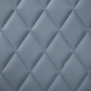 Close-up of a quilted blue fabric texture