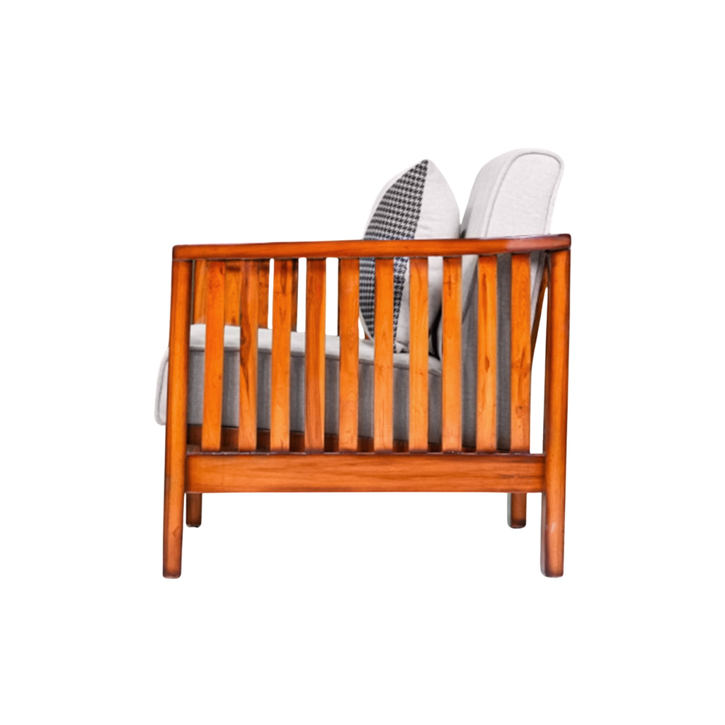 Wooden crib with white mattress and gray bedding on a white background