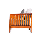 Wooden crib with white mattress and gray bedding on a white background