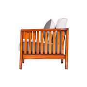 Wooden crib with white mattress and gray bedding on a white background
