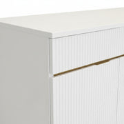 White cabinet with a gold accent on a white background