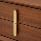 Wooden drawer with a gold handle