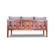 Wooden bench with gray cushions on a white background