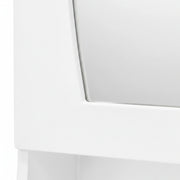 Close-up of a white electronic device with a reflective surface on a white background
