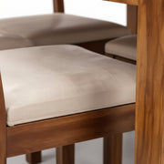 Diamond fabric cushioned chair seat close-up