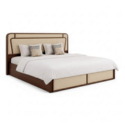 Bed with brown frame and beige headboard on a white background