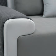 Gray sofa with quilted armrest detail