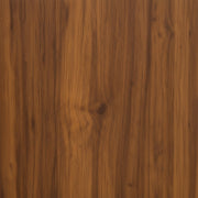 Close-up of a wooden surface with a rich brown color and visible grain.