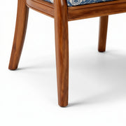 Close-up of a wooden chair leg on a white background
